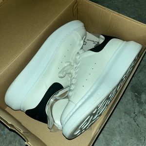 Worn a few times. A tiny scuff mark. paid $471 for them.